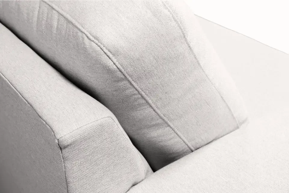 Macro detail of plush light-gray Zen cushion fabric and stitched seams