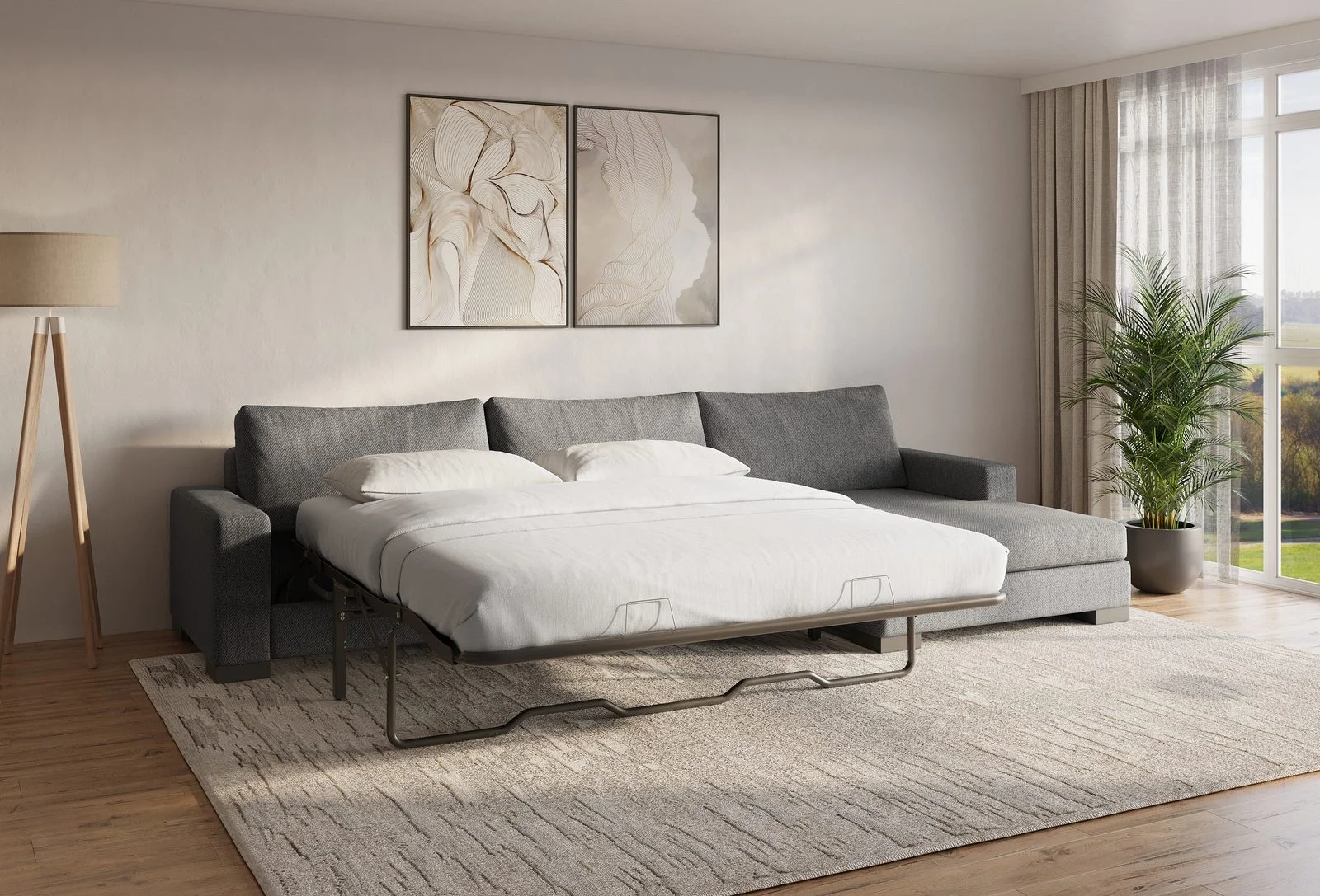 Charcoal-gray Zen sofa bed pulled out flat in a contemporary living room with floor lamp and palm plant