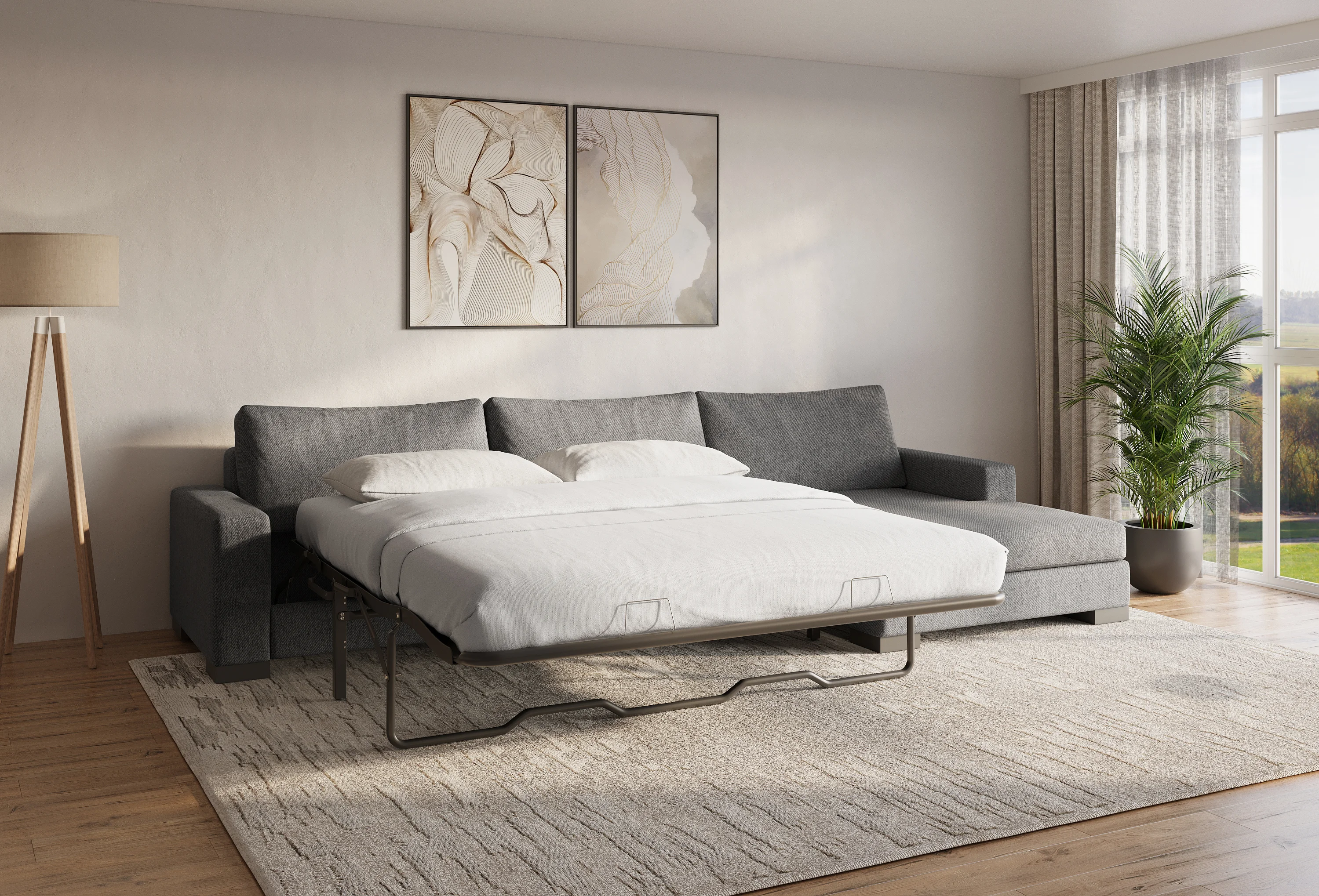 Charcoal-gray Zen sofa bed pulled out flat in a contemporary living room with floor lamp and palm plant
