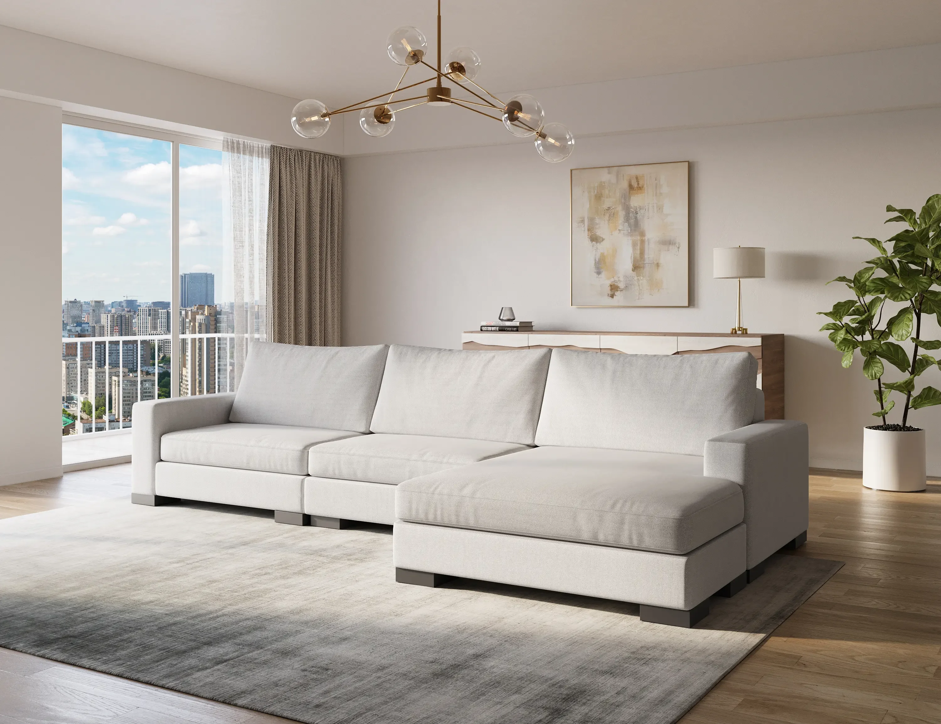 Light gray Zen modular sofa with chaise in a bright modern living room with chandelier and skyline view