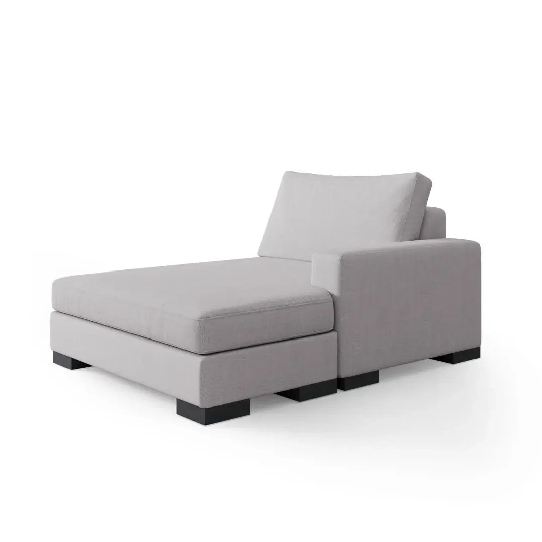 Custom sofa with chaise extension and matching storage ottoman in light gray upholstery